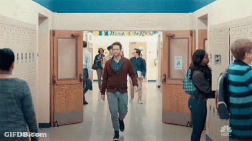 Man In White Shirt Standing By Door GIF