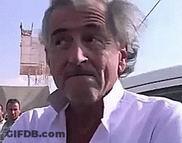 Man In White Shirt Standing In Front Of Car GIF