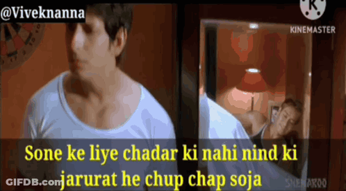 Man In White Shirt Standing In Front Of Mirror GIF