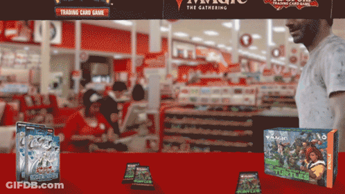 Man In White Shirt Standing In Front Of Trading Card Game GIF