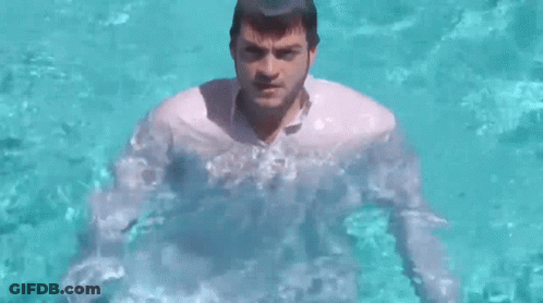 Man In White Shirt Standing In Water GIF
