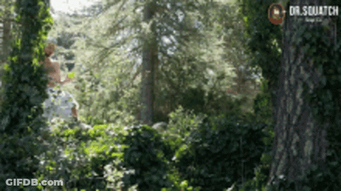Man In White Shirt Standing In Woods Dr.Squatch GIF