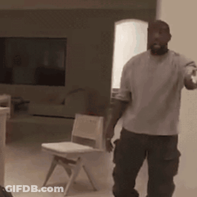 Man In White Shirt Standing Next To Child Chair GIF