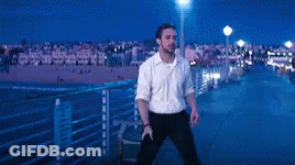 Man In White Shirt Standing On Pier At Night GIF