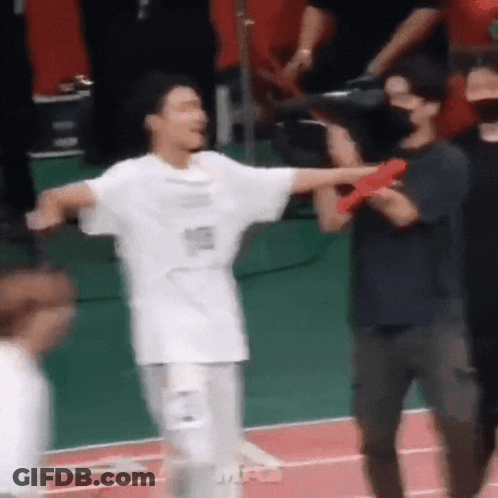 Man In White Shirt Standing On Track GIF