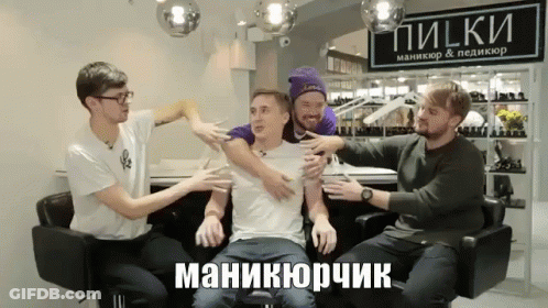 Man In White Shirt Surrounded By Men GIF