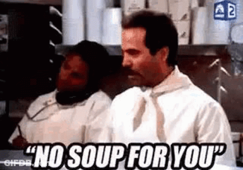 Man In White Shirt Talking On Cell Phone In Kitchen GIF