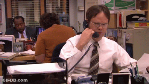 Man In White Shirt Talking On Phone GIF