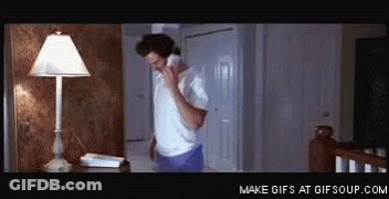 Man In White Shirt Talking On Phone GIF