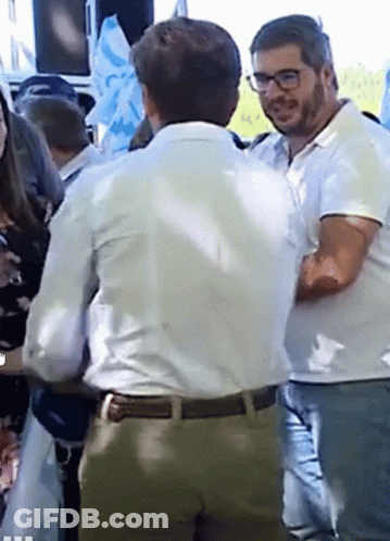 Man In White Shirt Talking To Man In Glasses GIF