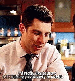 Man In White Shirt Talking To Man In Kitchen GIF