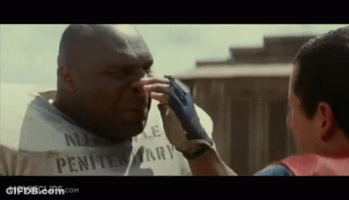 Man In White Shirt Touching Another Man's Nose Penitentiary GIF