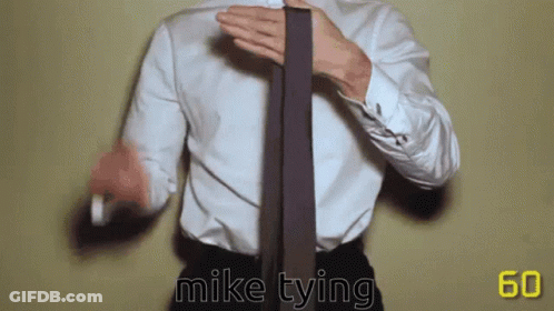 Man In White Shirt Tying Tie Saying Mike Tying GIF