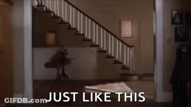 Man In White Shirt Walking Down Stairs GIF
