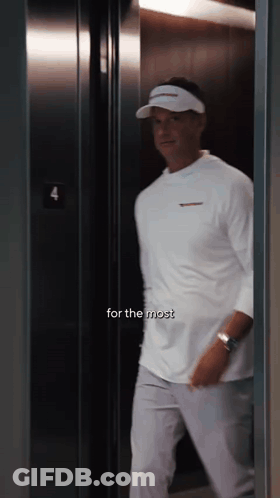 Man In White Shirt Walking Into Elevator 4 GIF