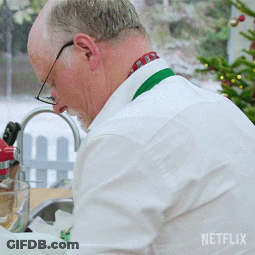 Man In White Shirt Washing Dishes With Netflix Logo GIF