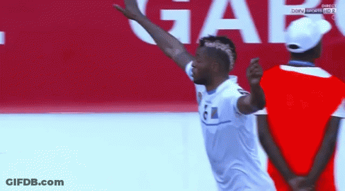 Man In White Shirt With 61 Jumping GIF