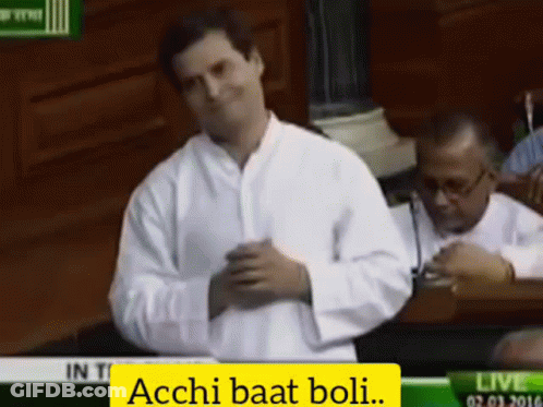 Man In White Shirt With Acchi Baat Boli On Screen GIF