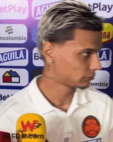 Man In White Shirt With Aguila Sign GIF