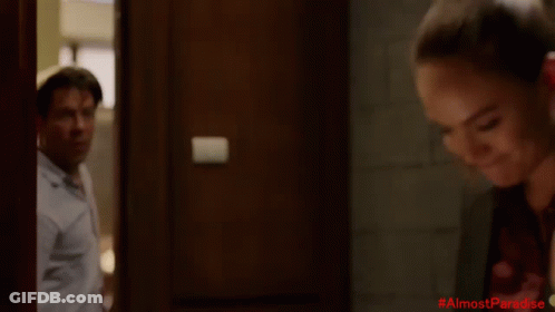 Man In White Shirt With #AlmostParadise In Red GIF
