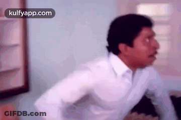 Man In White Shirt With Arms Outstretched GIF
