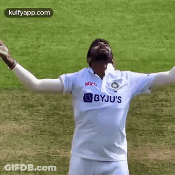 Man In White Shirt With Arms Outstretched Smiling GIF