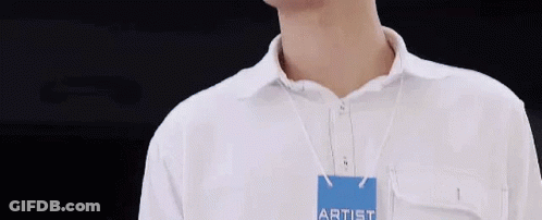 Man In White Shirt With Artist Name Tag GIF