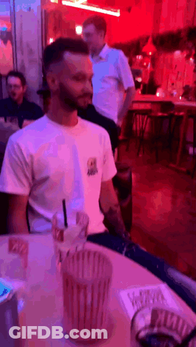Man In White Shirt With Drink GIF