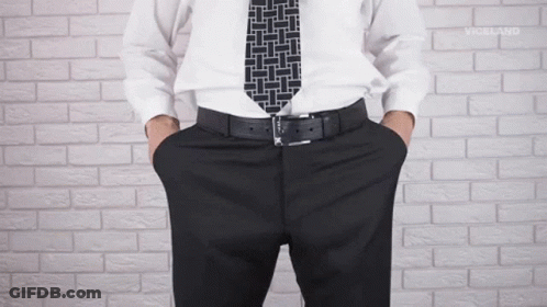 Man In White Shirt With Hands In Pockets GIF