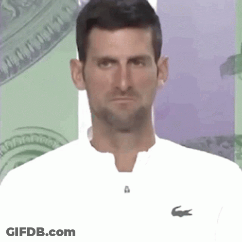 Man In White Shirt With Lacoste Logo Making Funny Face GIF