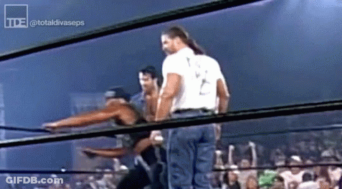 Man In White Shirt With Letter T In Wrestling Ring GIF