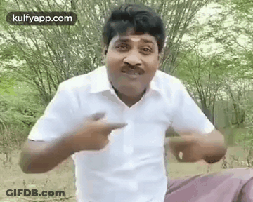 Man In White Shirt With Mustache Pointing At Camera GIF