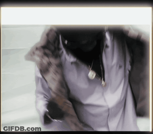Man In White Shirt With Necklace Letter N GIF