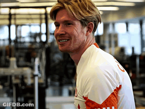 Man In White Shirt With Number 8 Smiling GIF