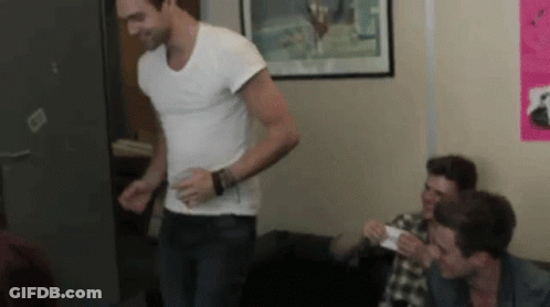 Man In White Shirt With Other Men GIF