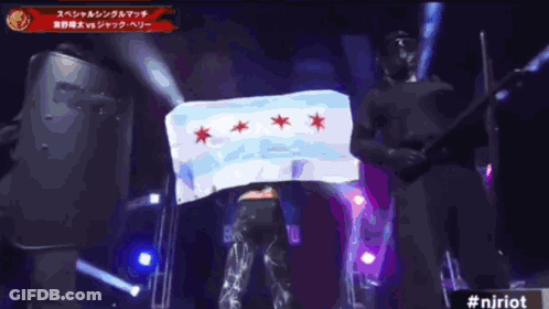 Man In White Shirt With Red Stars On Stage GIF
