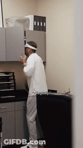Man In White Shirt With Word Allegedly GIF