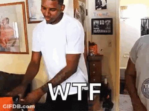 Man In White Shirt With WTF On Wall GIF