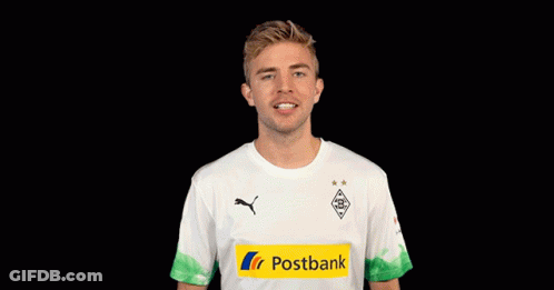 Man In White Shirt With Yellow Postbank Logo GIF
