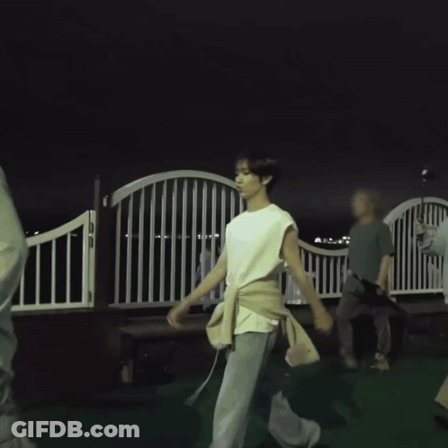 Man In White Sleeveless Shirt Walking GIF