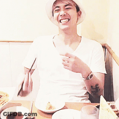 Man In White Sophnet Hat Eating With Chopsticks GIF