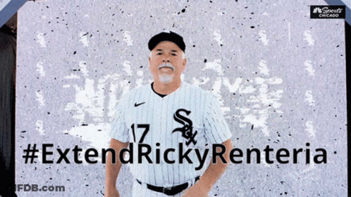 Man In White Sox Jersey In Front Of #ExtendRickyRenteria Sign GIF