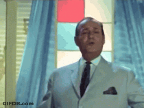 Man In White Suit And Black Tie GIF