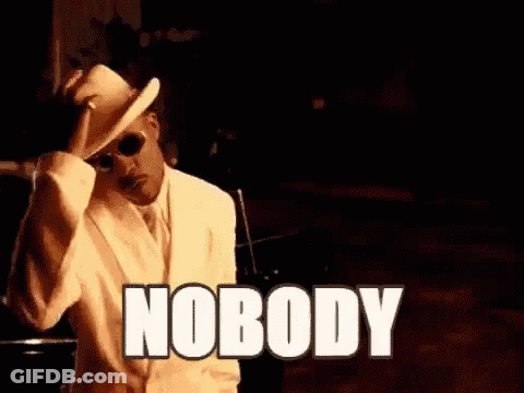 Man In White Suit And Hat Sitting Says Nobody GIF