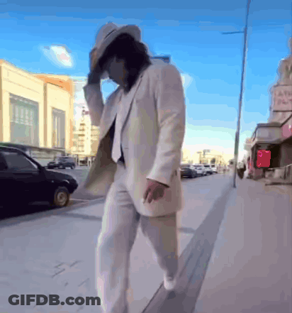 Man In White Suit And Hat Walking GIF