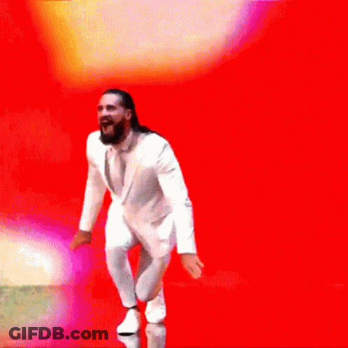 Man In White Suit Dancing Colorful Background GIF