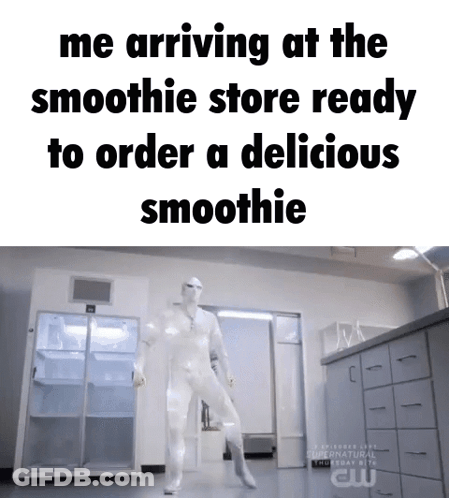 Man In White Suit Dancing In Front Of Smoothie Store GIF