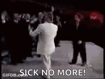 Man In White Suit Dancing On Stage GIF