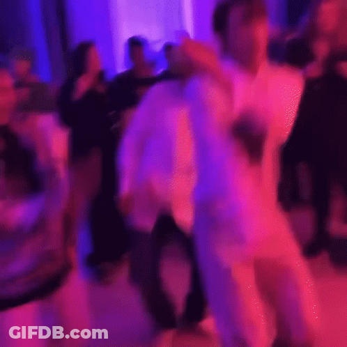 Man In White Suit Dancing GIF