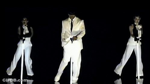 Man In White Suit Dancing With Two Women GIF